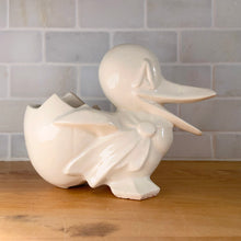 Load image into Gallery viewer, Vintage gloss white Duck and Egg planter. Crafted by McCoy Pottery, 1950s. This rare planter must for any art pottery collector!
In used vintage condition, no chips/repairs, tight hairline at the back of the egg, cold paint has rubbed off. McCoy mark on the bottom.
Measures 7 x 3 1/4 x 5 1/4 inches