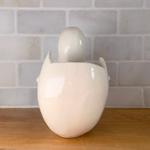 Load image into Gallery viewer, Vintage gloss white Duck and Egg planter. Crafted by McCoy Pottery, 1950s. This rare planter must for any art pottery collector!
In used vintage condition, no chips/repairs, tight hairline at the back of the egg, cold paint has rubbed off. McCoy mark on the bottom.
Measures 7 x 3 1/4 x 5 1/4 inches