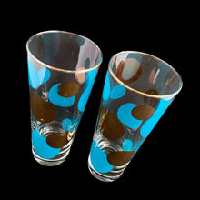 Load image into Gallery viewer, RARE FIND!
Vintage mid century era Eclipse cooler glass featuring blue and 22 karat gold dots in varying size with gold rims. Designed by Russel Wright, American industrial designer, for Bartlett Collins, 1958. A must-have for the serious MCM barware collector...cheers!
In great vintage condition, no chips, very minor age related wear to the gold.
Measures 2 7/8 x 6 7/8 inches
Capacity 16 ounces