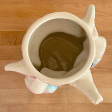 Load image into Gallery viewer, Vintage mid-century hand painted figural white elephant ceramic cookie jar with blue and yellow sailor hat and overalls and pink details. Crafted by American Bisque, USA, circa 1950s. Add some kitsch to your kitchen decor with this adorable collectible!
In excellent condition, no chips or cracks, age-related crazing. Marked USA on the back of the jar.
Measures 8 1/2 x 6 x 10 1/2 inches