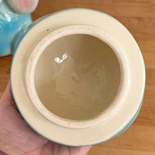 Load image into Gallery viewer, Vintage mid-century hand painted figural white elephant ceramic cookie jar with blue and yellow sailor hat and overalls and pink details. Crafted by American Bisque, USA, circa 1950s. Add some kitsch to your kitchen decor with this adorable collectible!
In excellent condition, no chips or cracks, age-related crazing. Marked USA on the back of the jar.
Measures 8 1/2 x 6 x 10 1/2 inches