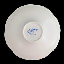 Load image into Gallery viewer, Vintage Elizabethan fine bone china Clare teacup and saucer with colourful roses and gold gilt filigree and trim. Crafted by Taylor & Kent, England, 1980s. A lovely way to enjoy a cuppa tea!
In excellent condition, no chips, cracks or repairs. Maker's mark on the bottom.
Measures 3 3/8 x 2 1/2 inches | Saucer measures 5 5/8 inches
