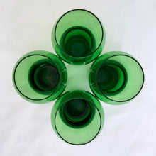 Load image into Gallery viewer, Funky set of four vintage emerald green hand blown glass tumblers. Crafted in Poland, circa 1960s. These glasses feature a bloated hourglass shape. Guaranteed to amp up your bar cart! In excellent condition, free from chips/wear. Original sticker present on each glass, marked "Made in Poland". Measures 2 3/8 x 3 3/8 inches Capacity 6 ounces