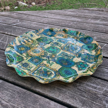 Load image into Gallery viewer, This FAB serving tray screams retro style with its vibrant blue, green, yellow and teal framed medallions of flowers, geometric objects and birds. Made by pressing gorgeous decorator fabric between 2 layers of a light-weight plastic material which was heat molded into a tray with a sweet ruffled edge. Produced by Hardy Glenwood in Canada, circa 1960/70. The perfect accessory for entertaining! In excellent used condition. Measures 17 1/4 inches