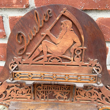 Load image into Gallery viewer, Incredible primitive antique Father Time handmade wood scroll saw wall hung shelf depicting the months of the year with scenes of figures, flora and fauna including birds, rabbits and flowers depicting an activity appropriate to the month, topped with a lounging Father Time with sycthe and hourglass. There are a total of 10 shelves which are notched together and removable, in addition there are 4 mirrors. In as found condition with a corder of the backboard damaged.