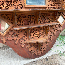 Load image into Gallery viewer, Incredible primitive antique Father Time handmade wood scroll saw wall hung shelf depicting the months of the year with scenes of figures, flora and fauna including birds, rabbits and flowers depicting an activity appropriate to the month, topped with a lounging Father Time with sycthe and hourglass. There are a total of 10 shelves which are notched together and removable, in addition there are 4 mirrors. In as found condition with a corder of the backboard damaged.