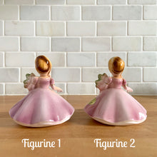 Load image into Gallery viewer, This sweet vintage mid-century figurine is one of the Birthday of the Month series designed by Josef Originals, Japan, 1950s. This sweet black-eyed girl is beautifully styled wearing a full length gown, hand painted in purple with raised flowers, holding a purple flowers with an amethyst birthstone in the centre of the flower. In excellent condition, free from chips/cracks/repairs. Marked on the bottom with the Noritake for Giftcraft mark. Measures 3 1/2 x 4 inches