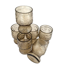 Load image into Gallery viewer, Set of six vintage smokey brown glass tumblers featuring an embossed floral and fruit design. Crafted by Fidenza Vetraria, Italy, 1970s. Perfect for everyday use or cocktails!
In excellent condition, no chips.
Measures 2 3/4 x 4 3/8 inches
Capacity 10 ounces