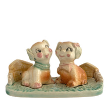 Load image into Gallery viewer, Vintage hand painted Fido and Flossie dogs ceramic salt and pepper shakers with a ceramic tray featuring a green grass area with yellow dog houses at either end. Crafted in Japan, 1940s. A darling set! In excellent vintage condition, no chips/cracks/repairs. Normal crazing present. Tray measures 5 1/4 x 3 x 2 3/4 inches Fido and Flossie 2 1/2 inches tall