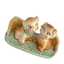 Load image into Gallery viewer, Vintage hand painted Fido and Flossie dogs ceramic salt and pepper shakers with a ceramic tray featuring a green grass area with yellow dog houses at either end. Crafted in Japan, 1940s. A darling set! In excellent vintage condition, no chips/cracks/repairs. Normal crazing present. Tray measures 5 1/4 x 3 x 2 3/4 inches Fido and Flossie 2 1/2 inches tall