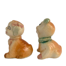 Load image into Gallery viewer, Vintage hand painted Fido and Flossie dogs ceramic salt and pepper shakers with a ceramic tray featuring a green grass area with yellow dog houses at either end. Crafted in Japan, 1940s. A darling set! In excellent vintage condition, no chips/cracks/repairs. Normal crazing present. Tray measures 5 1/4 x 3 x 2 3/4 inches Fido and Flossie 2 1/2 inches tall