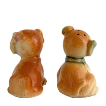 Load image into Gallery viewer, Vintage hand painted Fido and Flossie dogs ceramic salt and pepper shakers with a ceramic tray featuring a green grass area with yellow dog houses at either end. Crafted in Japan, 1940s. A darling set! In excellent vintage condition, no chips/cracks/repairs. Normal crazing present. Tray measures 5 1/4 x 3 x 2 3/4 inches Fido and Flossie 2 1/2 inches tall