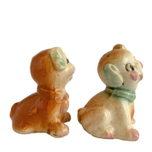 Load image into Gallery viewer, Vintage hand painted Fido and Flossie dogs ceramic salt and pepper shakers with a ceramic tray featuring a green grass area with yellow dog houses at either end. Crafted in Japan, 1940s. A darling set! In excellent vintage condition, no chips/cracks/repairs. Normal crazing present. Tray measures 5 1/4 x 3 x 2 3/4 inches Fido and Flossie 2 1/2 inches tall