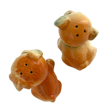 Load image into Gallery viewer, Vintage hand painted Fido and Flossie dogs ceramic salt and pepper shakers with a ceramic tray featuring a green grass area with yellow dog houses at either end. Crafted in Japan, 1940s. A darling set! In excellent vintage condition, no chips/cracks/repairs. Normal crazing present. Tray measures 5 1/4 x 3 x 2 3/4 inches Fido and Flossie 2 1/2 inches tall