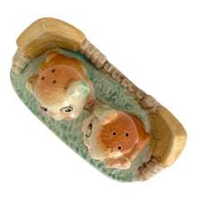 Load image into Gallery viewer, Vintage hand painted Fido and Flossie dogs ceramic salt and pepper shakers with a ceramic tray featuring a green grass area with yellow dog houses at either end. Crafted in Japan, 1940s. A darling set! In excellent vintage condition, no chips/cracks/repairs. Normal crazing present. Tray measures 5 1/4 x 3 x 2 3/4 inches Fido and Flossie 2 1/2 inches tall