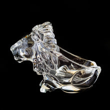 Load image into Gallery viewer, This vintage figural crystal glass seated lion pipe rest is sure to be a conversation starter. Crafted by Art Vannes, France, circa 1960s/70s. With its elegant and powerful presence, this stunning lion may be used as intended, or as a paperweight and candy dish. Whichever your choice, this piece will add an extra touch of sophistication to any corner of your room. In excellent condition, free from chips/wear. Maker's mark on the bottom. Measures 6 3/4 x 2 5/8 x 4 1/2 inches