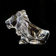 Load image into Gallery viewer, This vintage figural crystal glass seated lion pipe rest is sure to be a conversation starter. Crafted by Art Vannes, France, circa 1960s/70s. With its elegant and powerful presence, this stunning lion may be used as intended, or as a paperweight and candy dish. Whichever your choice, this piece will add an extra touch of sophistication to any corner of your room. In excellent condition, free from chips/wear. Maker's mark on the bottom. Measures 6 3/4 x 2 5/8 x 4 1/2 inches