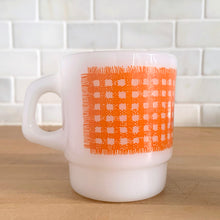 Load image into Gallery viewer, Vintage Fire-King orange gingham milk glass mug, opposite side profile showing gingham pattern detail and handle