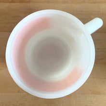 Load image into Gallery viewer, Overhead view of vintage Fire-King orange gingham milk glass mug, showing interior and rim