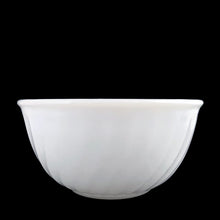 Load image into Gallery viewer, Vintage Anchor Hocking Fire-King Swirl 7-inch white milk glass mixing bowl, straight-on front view showing the diagonal swirl ribbing pattern and rolled rim, USA, 1949–1962
