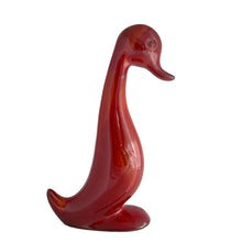 Load image into Gallery viewer, Handcrafted by Blue Mountain Pottery in 1970s Canada, this rare duck figurine exemplifies the studio's mastery of flambé glazing. The redware body is adorned with a sophisticated interplay of burnt orange and deep red hues that pool and streak across the surface, creating an organic, one-of-a-kind finish. A prized addition for collectors of vintage Canadian pottery and mid-century ceramic design with an eye for authentic craftsmanship and historical provenance.