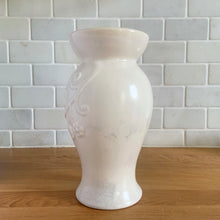 Load image into Gallery viewer, Vintage off-white pale mauve sponge glazed art pottery vase featuring embossed flowers on vine, shape 864. Crafted by Redwing Pottery, USA 1950s. Perfect for creating a beautiful floral arrangement or to use as home decor. A great gift for the art pottery collector. In excellent condition, no chips/cracks/repairs. Measures 4 x 8 inches