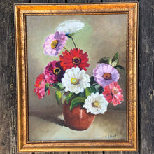 Load image into Gallery viewer, Breathtaking beautiful original vintage floral still life oil painting on board of zinnia flowers in shades of red, deep pink and white a deep ochre vessel on a green mottled background. Signed by the artist, B. Albert. Framed in gold toned, black spattered wood. Lovingly crafted, this one-of-a-kind piece will add an exquisite touch of warmth to your home decor.