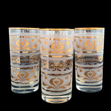 Load image into Gallery viewer, Set of four, vintage mid-century highball cocktail glasses featuring 22kt gold florals on frosted panels with gold rims. Crafted by Dominion Glass, Canada, 1960s/70s. These glasses were literally is everyone's rec rooms in the 60s and 70s and are perfect for any occasion or cocktail!
In excellent condition, no chips.
Measures 2 3/4 x 5 1/2 inches
Capacity 10 ounces