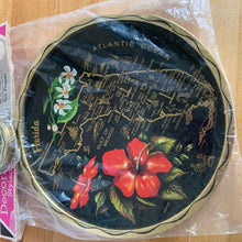 Load image into Gallery viewer, Vintage Florida souvenir black and gold metal tray and coaster set featuring a red hibiscus and white orchid flower alongside a gold map of Florida. The perfect addition to your tropical or tiki barware collection! In excellent condition, new in package. Tray measures 10 7/8 inches Coasters measure 3 1/2 inches