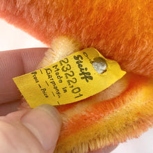 Load image into Gallery viewer, Detail of the original Steiff silver script button and yellow tag (2322,01) on the fin.