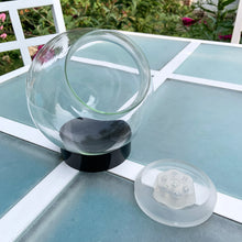 Load image into Gallery viewer, Funky vintage retro glass flower aquarium. Preserve your flowers with this glass globe using only water and vinegar. Regal Greetings and Gift, made in Germany, 1970s. The 7 stem holders in the rubber gasket allow you to create a indoor garden oasis with the illusion of magnified floral display...so cool! Easily repurpose as a display piece by filling it with lights or a collection of Christmas ornaments. New old stock, in the original box. In excellent condition. Measures 5 1/2 x 7 inches