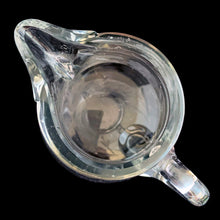 Load image into Gallery viewer, Sweet vintage cut crystal syrup pitcher featuring cut flowers and stems with removable metal hinged lid and applied blown handle. Crafted by Heisey Glass, USA, circa 1920s. A beautiful addition to your tablescape!
In great vintage condition, no chips, wear to the lid.
Measures 3 1/8 x 3 inches
