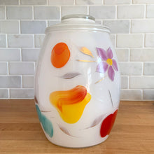 Load image into Gallery viewer, Vintage mid-century white glass lidded canister or cookie jar hand painted with flowers and fruits. Crafted by Bartlett Collins, 1960s. A nice sized and pretty jar to store cookies or dry goods.
In excellent condition, no chips, minor wear to the gold.
Measures 7 x 9 1/2 inches