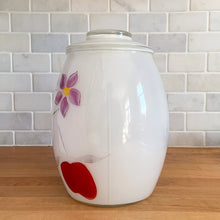 Load image into Gallery viewer, Vintage mid-century white glass lidded canister or cookie jar hand painted with flowers and fruits. Crafted by Bartlett Collins, 1960s. A nice sized and pretty jar to store cookies or dry goods.
In excellent condition, no chips, minor wear to the gold.
Measures 7 x 9 1/2 inches