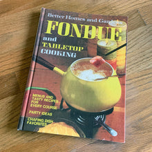 Load image into Gallery viewer, Better Homes and Gardens is known for its fabulous cookbooks. This hardcover cookbook focuses on fondue and tabletop cooking inspired recipes. Its 96 pages are filled with amazing recipes along with many colour photographs. Originally published by Meredith Corporation, USA, 1970. First edition, eleventh printing 1973. In great vintage condition with normal age-related yellowing.