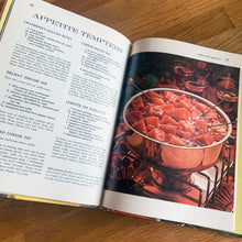 Load image into Gallery viewer, Better Homes and Gardens is known for its fabulous cookbooks. This hardcover cookbook focuses on fondue and tabletop cooking inspired recipes. Its 96 pages are filled with amazing recipes along with many colour photographs. Originally published by Meredith Corporation, USA, 1970. First edition, eleventh printing 1973. In great vintage condition with normal age-related yellowing.