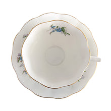 Load image into Gallery viewer, Vintage Avon shaped Forget-Me-Not bone china teacup and saucer, features a scalloped edge with hand painted blue flowers and gold gilt rim. Royal Albert, England, 1950s. In excellent condition, free from chips, cracks and repairs. Makers marks present. Teacup measures 3 1/4 x 2 3/4 inches | Saucer measures 5 1/2 inches