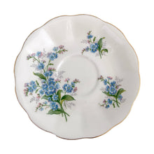 Load image into Gallery viewer, Vintage Avon shaped Forget-Me-Not bone china teacup and saucer, features a scalloped edge with hand painted blue flowers and gold gilt rim. Royal Albert, England, 1950s. In excellent condition, free from chips, cracks and repairs. Makers marks present. Teacup measures 3 1/4 x 2 3/4 inches | Saucer measures 5 1/2 inches