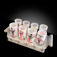 Load image into Gallery viewer, handle steel caddy holding eight Gay Fad Studios Gay Nineties glasses