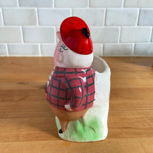 Load image into Gallery viewer, Rare vintage colourful ceramic planter featuring a gentleman hunter sporting a red cap and plaid hunting jacket gun and adorable hunting dog. Crafted by R/P, Japan, circa 1950s. An unique piece to add to your planter or hunting collection! In excellent condition, no chips/cracks/repairs. Rifle end missing and could easily be replaced with a piece of metal Measures 5 x 2 7/8 x 5 1/4 inches