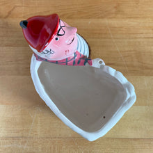 Load image into Gallery viewer, Rare vintage colourful ceramic planter featuring a gentleman hunter sporting a red cap and plaid hunting jacket gun and adorable hunting dog. Crafted by R/P, Japan, circa 1950s. An unique piece to add to your planter or hunting collection! In excellent condition, no chips/cracks/repairs. Rifle end missing and could easily be replaced with a piece of metal Measures 5 x 2 7/8 x 5 1/4 inches