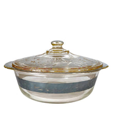 Load image into Gallery viewer, Vintage clear Fire-King 2 quart lidded casserole with a stunning floral silver overlay by Georges Briard for Anchor Hocking, USA, circa 1960s.
In as found vintage condition with a minor chip to the inner rim of the casserole and wear to the silver. The lid is in excellent condition, no chips or wear.
Measures 10 x 5 1/2 inches
Capacity 2 quarts