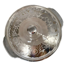 Load image into Gallery viewer, Vintage clear Fire-King 2 quart lidded casserole with a stunning floral silver overlay by Georges Briard for Anchor Hocking, USA, circa 1960s.
In as found vintage condition with a minor chip to the inner rim of the casserole and wear to the silver. The lid is in excellent condition, no chips or wear.
Measures 10 x 5 1/2 inches
Capacity 2 quarts