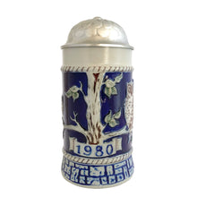 Load image into Gallery viewer, Front view showing the "1980" banner relief, tree trunk detail, and a single owl partially visible on the cobalt blue body, lid closed
