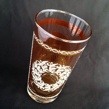 Load image into Gallery viewer, Stunning set of eight Vintage mid-century luxury highball glass tumblers, decorated with a 24 karat gold starburst, gold floral decorative white sugar texture wreath, a gold border overlayed with an atomic pattern, also in white sugar texture. Crafted by the talented designers of the Libbey Glass Company, USA, circa 1950s/60s. These beauties will add an exquisite touch to any occasion - indulge your guests with these truly special cocktail glasses.