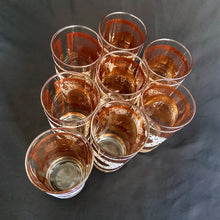 Load image into Gallery viewer, Stunning set of eight Vintage mid-century luxury highball glass tumblers, decorated with a 24 karat gold starburst, gold floral decorative white sugar texture wreath, a gold border overlayed with an atomic pattern, also in white sugar texture. Crafted by the talented designers of the Libbey Glass Company, USA, circa 1950s/60s. These beauties will add an exquisite touch to any occasion - indulge your guests with these truly special cocktail glasses.