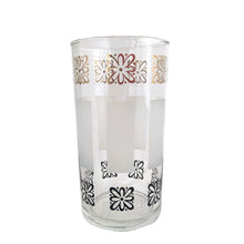 Load image into Gallery viewer, Sip in style with vintage mid-century highball cocktail glass tumblers featuring gold and black atomic style flowers with frosted bands! These elegant glasses from the Libbey Glass Company, USA, circa 1950s are sure to make a statement at your next dinner party. Enjoy the unique blend of classic mid-century style and modern vibrancy in each glass!