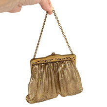 Load image into Gallery viewer, Gorgeous vintage art deco style gold toned metal mesh evening bag, lined with peachy-clay coloured fabric with pocket, kiss closure with filigree and decorative serpentine chain handle. Crafted by Whiting and Davis, USA, circa 1940s/1950s. A wonderful period piece that would make an fabulous accessory and perfect prop for photography, TV or movies!
Measures 7 3/4 x 5 1/2 inches