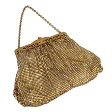 Load image into Gallery viewer, Gorgeous vintage art deco style gold toned metal mesh evening bag, lined with peachy-clay coloured fabric with pocket, kiss closure with filigree and decorative serpentine chain handle. Crafted by Whiting and Davis, USA, circa 1940s/1950s. A wonderful period piece that would make an fabulous accessory and perfect prop for photography, TV or movies!
Measures 7 3/4 x 5 1/2 inches
