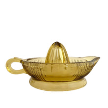 Load image into Gallery viewer, Vintage gold vertically ribbed citrus reamer with spout and finger handle. Crafted by Anchor Hocking, 1950/60s. The perfect accessory for kitchen and bar for fresh squeezed orange, lemon and lime juice...no sugar added!
In vintage condition, rough mold release at the spout, chip to the underside interior rim.
Measures 6 x 8 1/2 x 4 inches (incl. handle/spout)